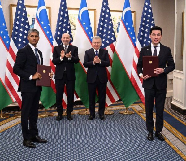 President Mirziyoyev, Secretary Lutnick, and Dr. Sivaraman display the signed MOU on Uzbekistan-U.S. water infrastructure partnership.